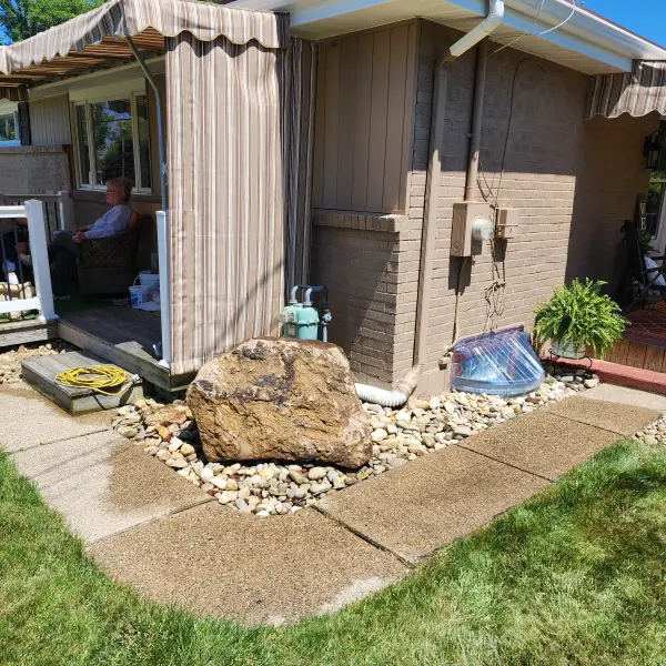 Lovely Corner Stone In landscape to block streat view of the gas meter